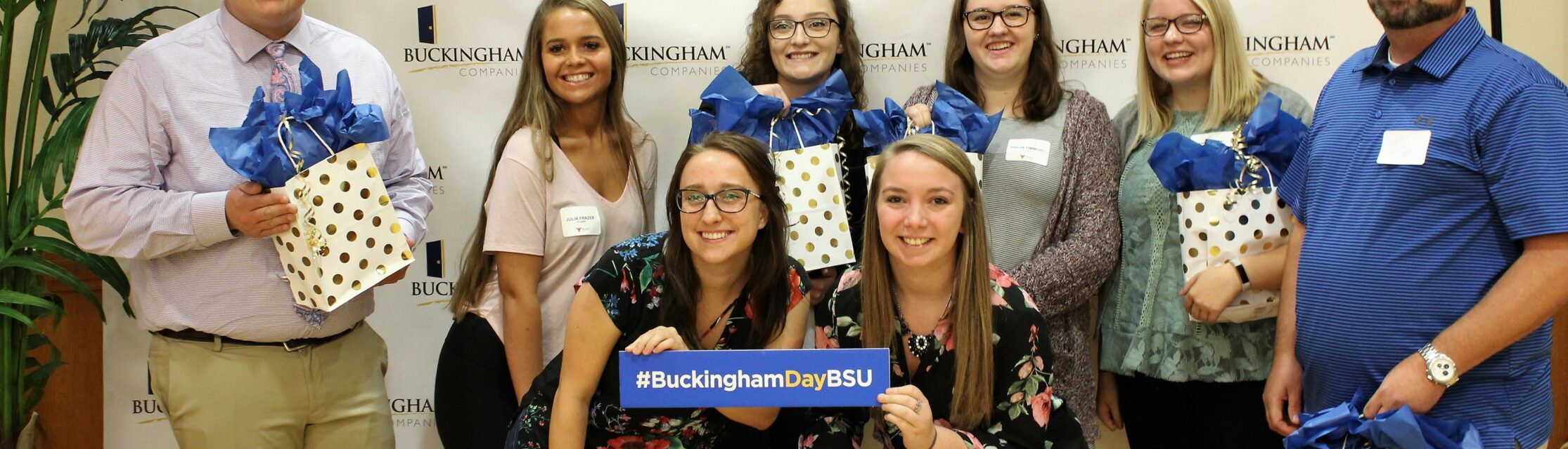 Group photo of Ball State University students holding presents at Buckingham Ball State Career Day
