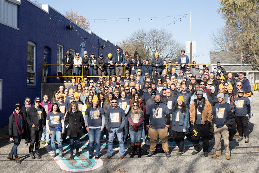 Group photo of Buckingham employees posing during Day of Service at Big Car